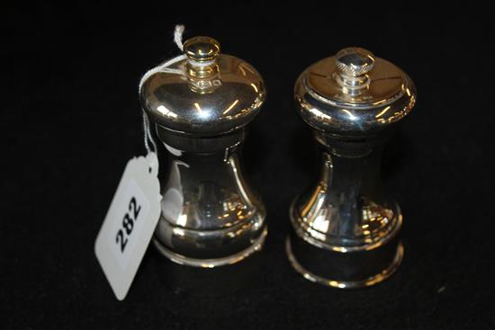 Two silver salt and pepper mills